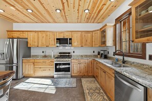 Fully stocked kitchen with utensils