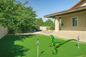 Enjoy a round of mini golf in your own private backyard—perfect fun for all ages!