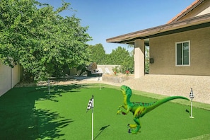 Enjoy a round of mini golf in your own private backyard—perfect fun for all ages!