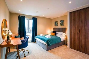 Bedroom 1 with King-sized bed and en-suite shower room
