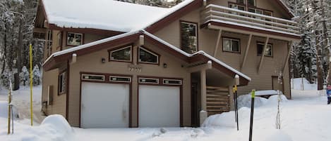 Two car garage with driveway space for three more cars.