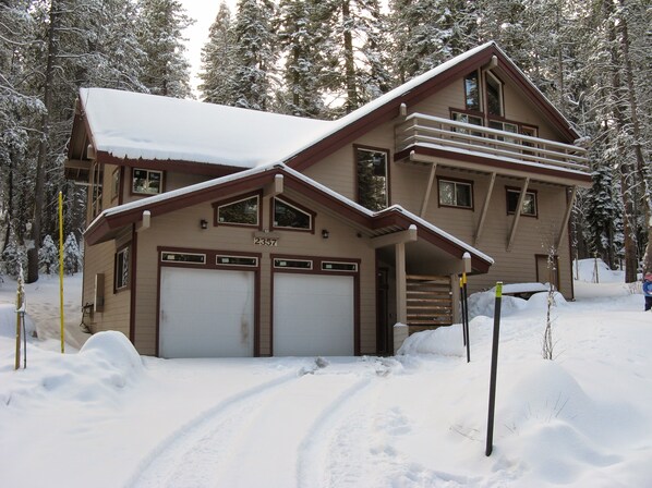 Two car garage with driveway space for three more cars.