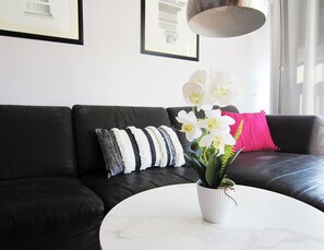 An EQ3 couch seats three comfortably after a long day of exploring the city!
