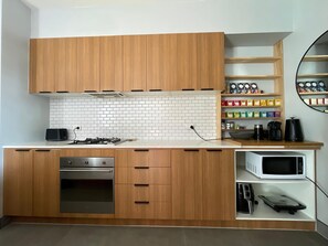 Full kitchen including oven, dishwasher, stove, toaster, microwave and air fryer