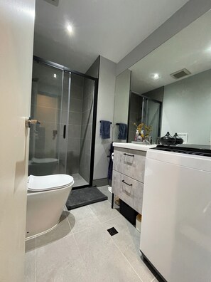 Bathroom - Modern bathroom including washing machine 