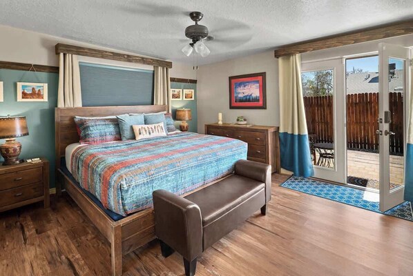 Master suite bedroom with back patio access and private bathroom