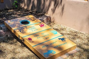 Corn hole in the front yard with personality
