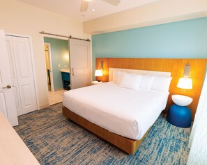 A cozy, inviting bedroom with soft lighting and a plush bed, perfect for a restful night’s sleep.