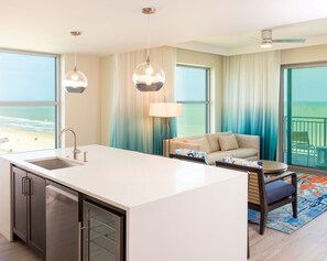 Bright and airy living area, featuring a modern kitchen and open layout.