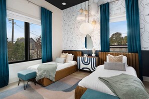 Inviting Bedroom with a Sleek, Modern Design and Two Twin Beds