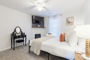 Queen bedroom with TV