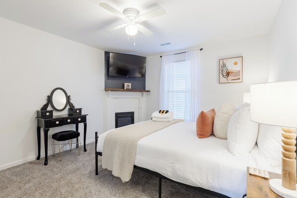 Queen bedroom with TV