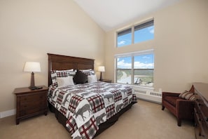 Master suite featuring a king bed, 42" smart TV, and amazing views