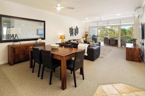Enjoy seamless flow between the living, dining, and kitchen areas—perfect for entertaining, family time, or relaxing after a day on the coast.