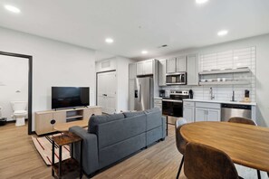 Living room and fully equipped kitchen