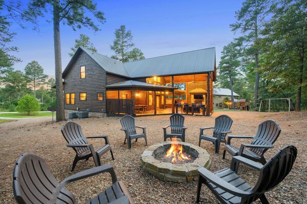 Cozy up around the fire pit under starlit skies and enjoy the peace that surrounds this beautiful home nestled in the heart of nature.
