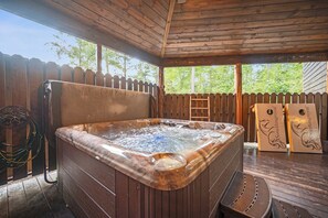 Soak up the beautiful atmosphere with our private hot tub on the patio, surrounded by nature's beauty!