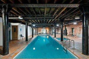 Dive into relaxation in the shared indoor pool, a tranquil spot for a refreshing swim no matter the weather.