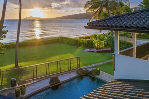 Relax by the pool with a cool drink and sunset views.