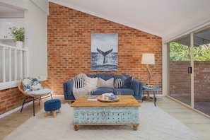 Bright and inviting lounge room, ideal for unwinding after a day of exploring Ettalong Beach.