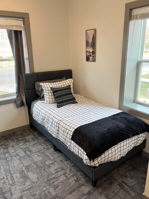 Twin bed in separate bedroom.