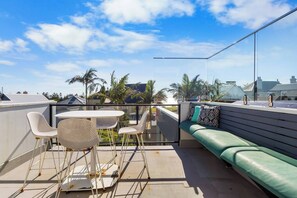 Soak up the sun and views from the private rooftop terrace, complete with outdoor seating and dining amenities.
