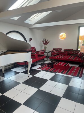 Movie room, grand piano (ornamental), snack bar, popcorn maker, Large TV, PS5