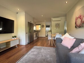 TrooBloo Glenelg North Unit | Living area showing the lounge, dining and kitchen