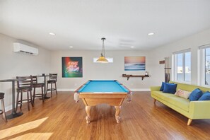 Gather, play, and unwind in this entertainment area with pool table!