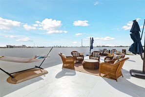 Lounge in the sun with stunning views and breezy open-air seating