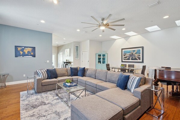 A cozy, spacious, modern living room with plush seating for relaxation.