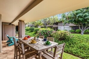 Eldorado E102 Relaxing lanai with dining set, overlooking the garden