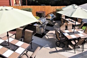 Shared outdoor patio with gas BBQ grills