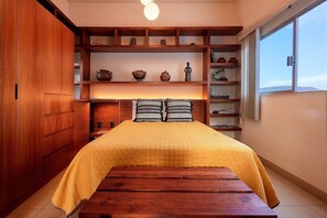 Queen bed, closet, view and regional decoration
