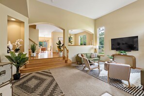 Living Room- As you enter you're welcomed by dramatic high ceilings. 75 inch TV