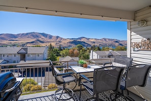 Private balcony with BBQ and outdoor seating.
