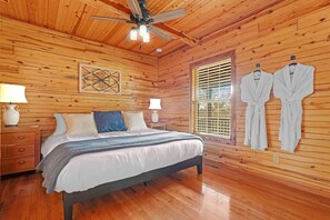 Luxurious king bed and robes for a romantic retreat