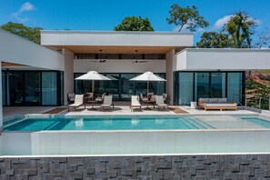 Drone shot looking back at the outdoor social area and pool