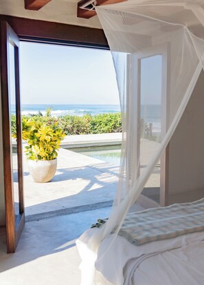 Bedroom right off the pool and steps from the ocean.