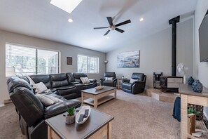 Bright and open living room with wood stove