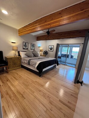 Master bedroom with bathroom, sunroom, closet, laundry, and deck access.