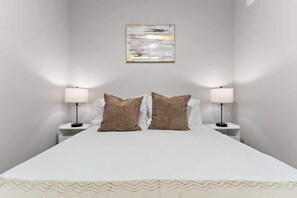 Queen Bed with bedside lamps
