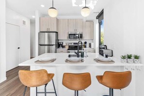 Fully stocked kitchen and dining area with modern appliances and everything you need to cook and enjoy meals at home