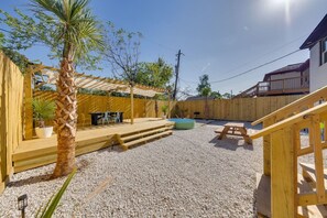 Patio Area: Spacious outdoor space with seating, ideal for enjoying fresh air.