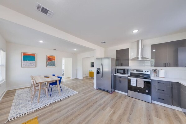 Dining Room: Chic dining area with a table for meals and gatherings.
