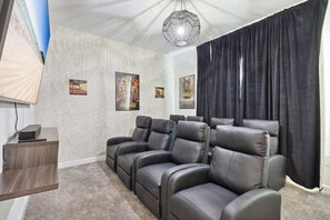 Cozy home theater with plush seating for the ultimate movie night.