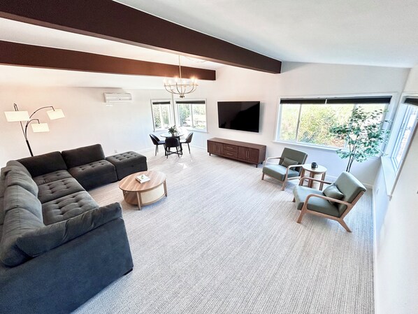 Spacious living room with TV, board games, toys, books, and Mountain Views.