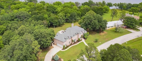 Breathtaking aerial view—our property nestled near the lake, surrounded by natural beauty.