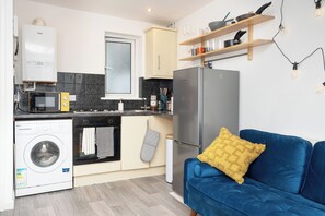 Fully equipped kitchen with complimentary tea, coffee and sugar. 

