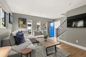 Lovely living space with flat screen TV and comfortable couch seating